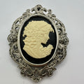 Silver tone rhodium plated genuine marcasite black white cameo brooch pendant