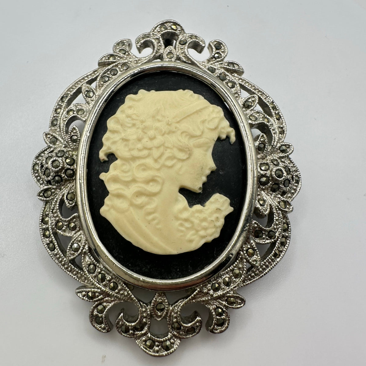 Silver tone rhodium plated genuine marcasite black white cameo brooch pendant