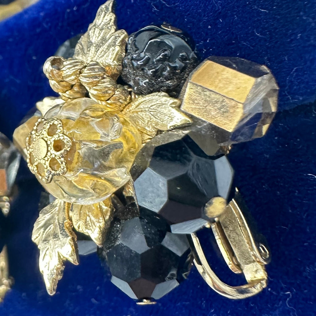 Vendome gold tone leaves black glass beads beaded cluster clip on earrings