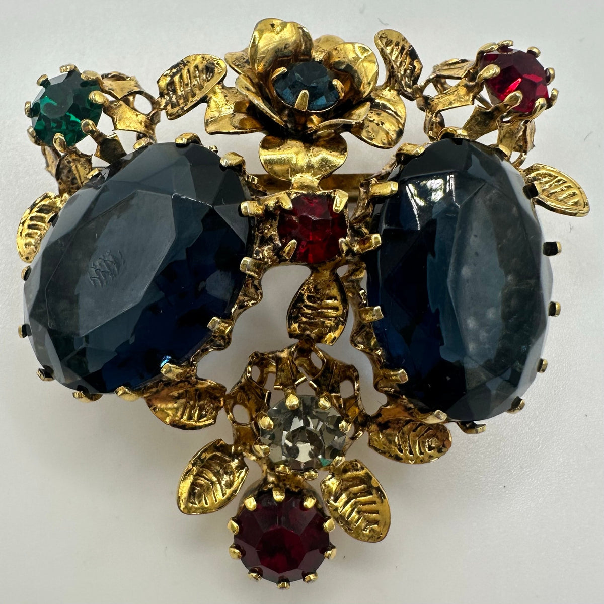 Unsigned Austria 1950s vintage gold tone multicolor rhinestones floral brooch