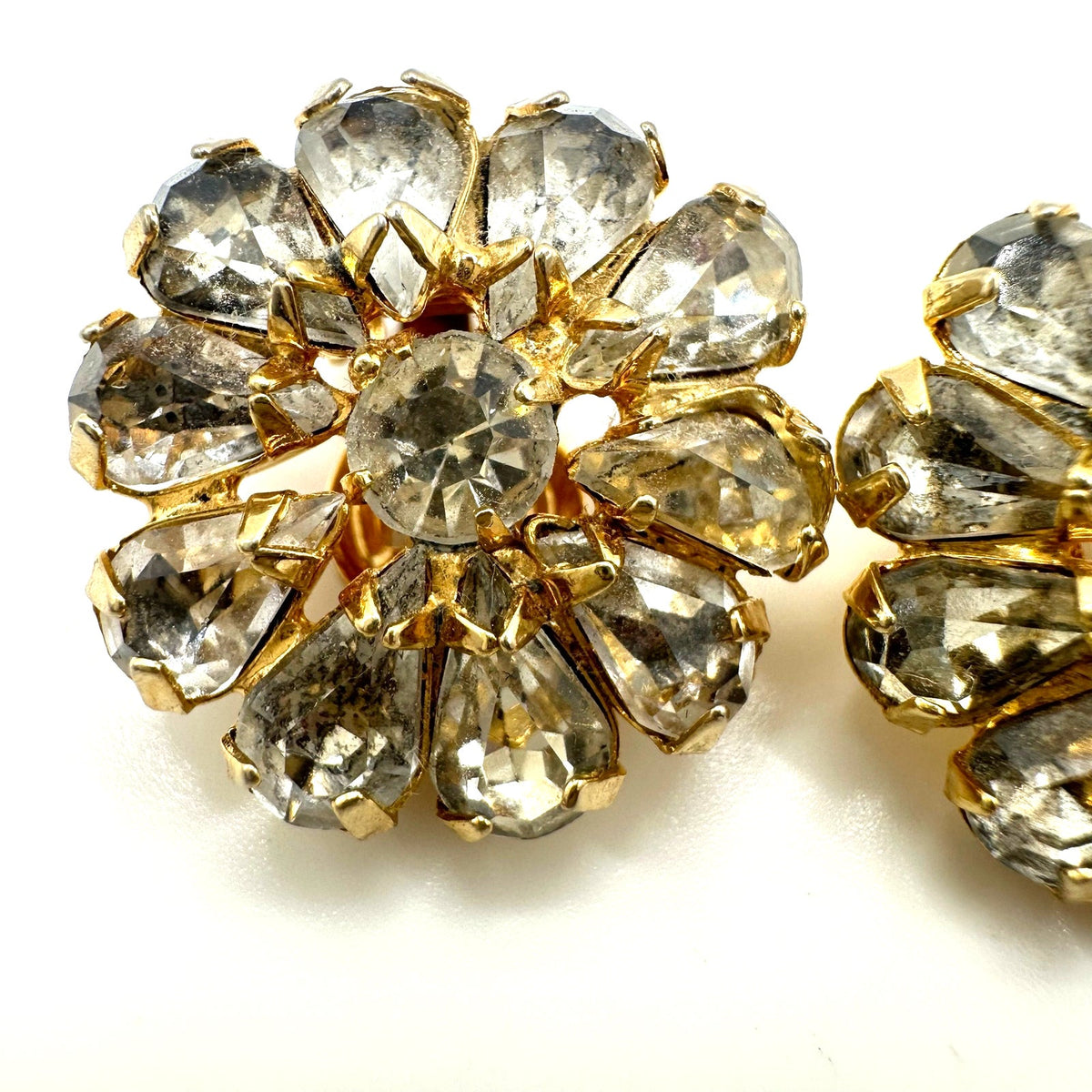 Vintage gold plated clear glass rhinestones round floral clip on earrings