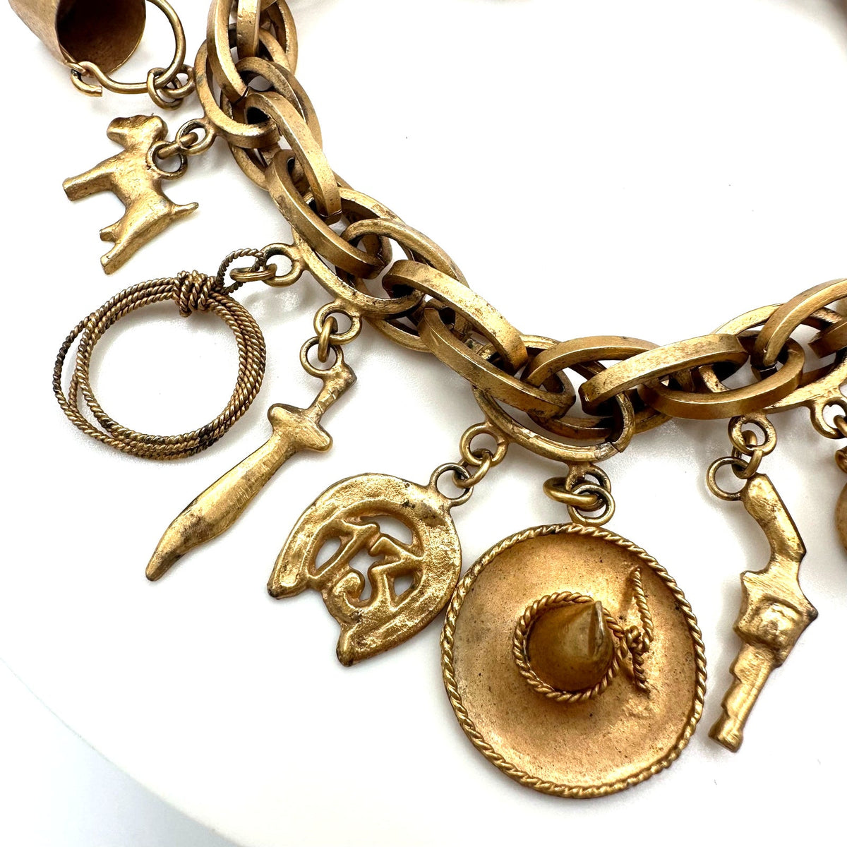 Vintage Made in Mexico midcentury gold tone 16 charms chain bracelet 7.5"