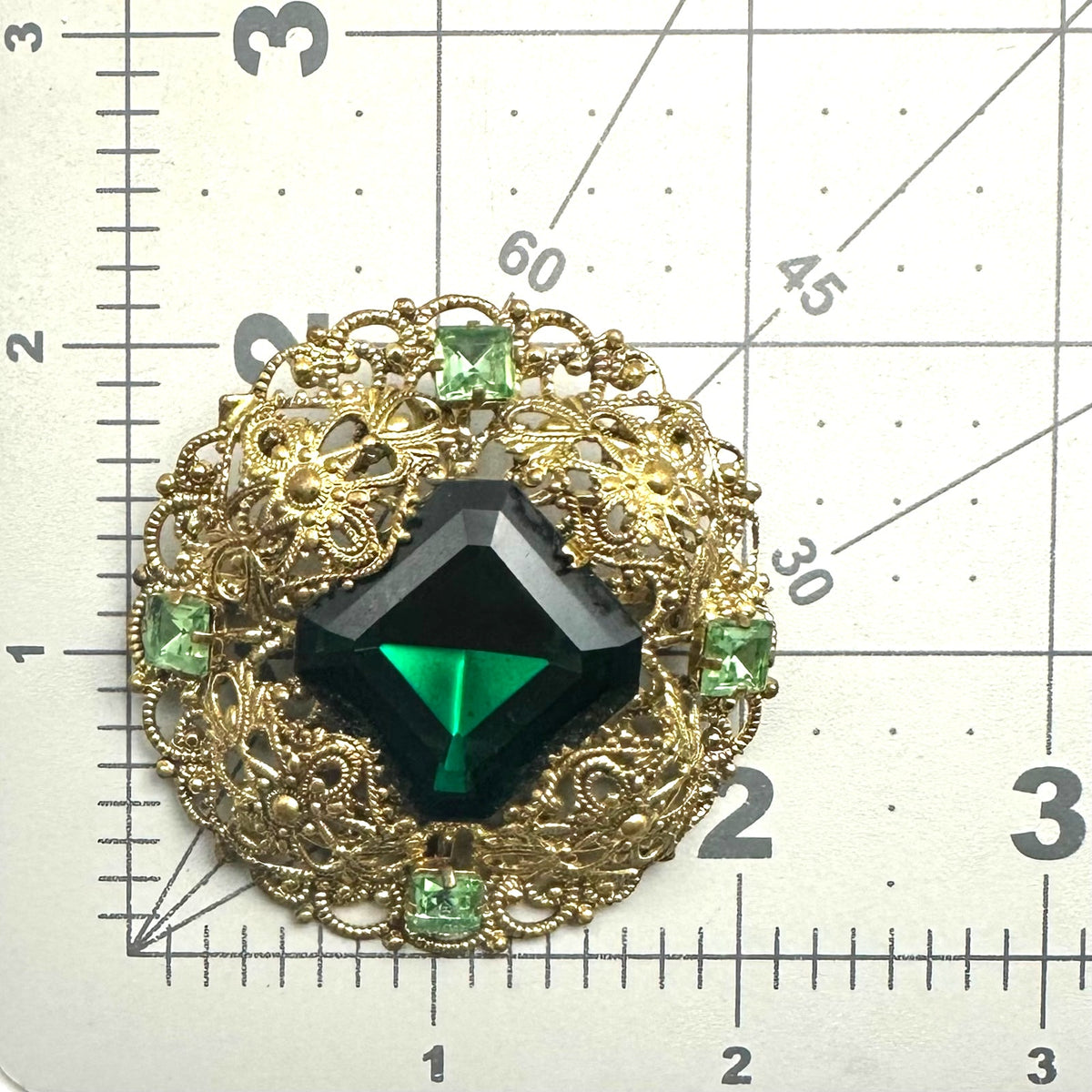 Vintage 1950s gold tone filigree massive emerald light green rhinestones brooch