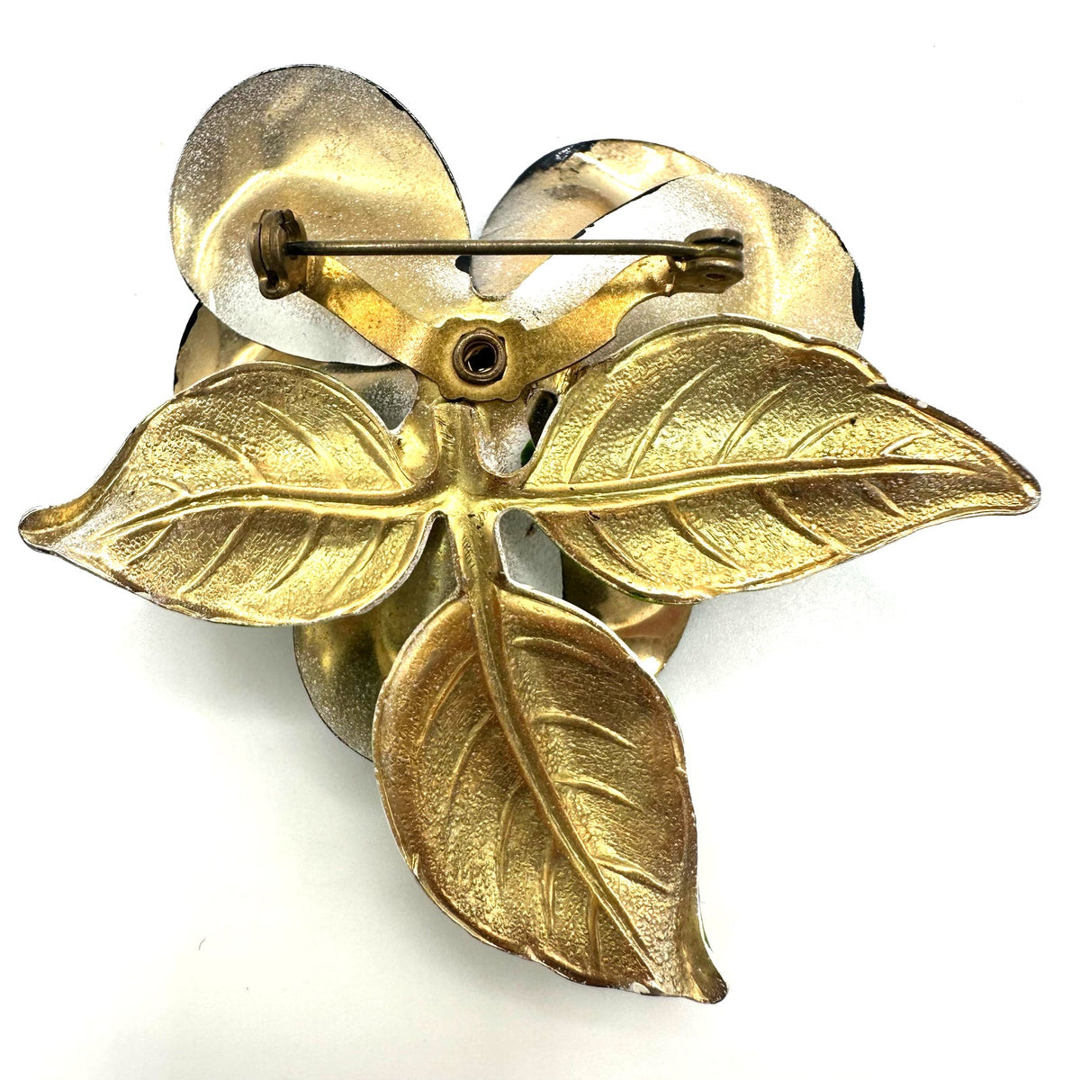 Vintage 1960s black white green enamel gold tone metal flower flower brooch