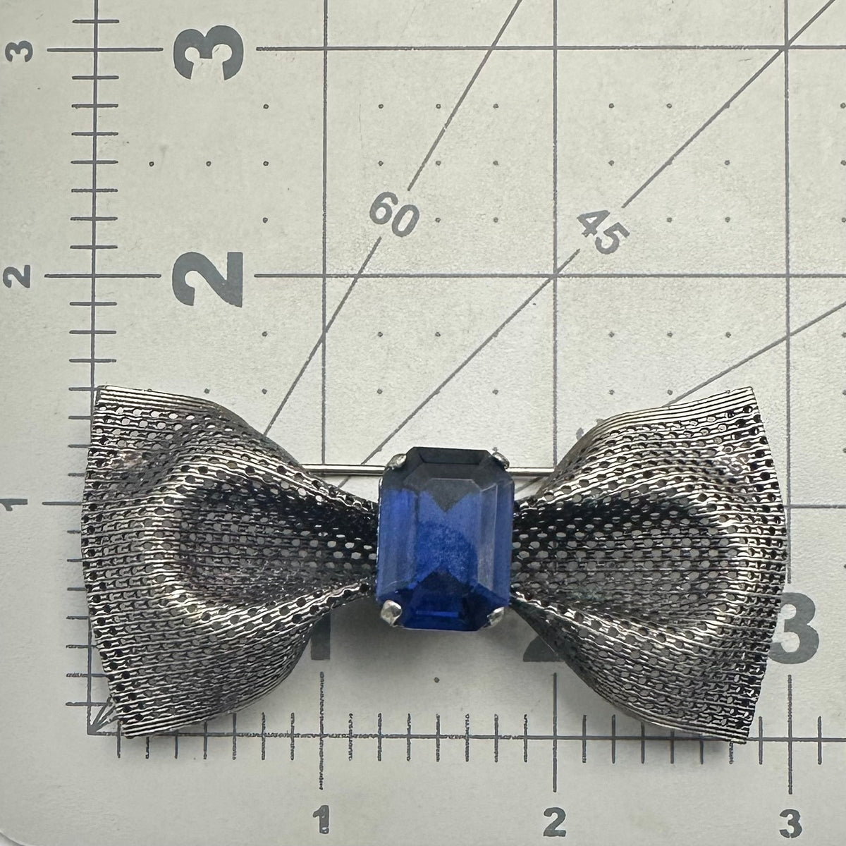 Vintage silver pewter tone mesh metal large blue glass rhinestone bow brooch