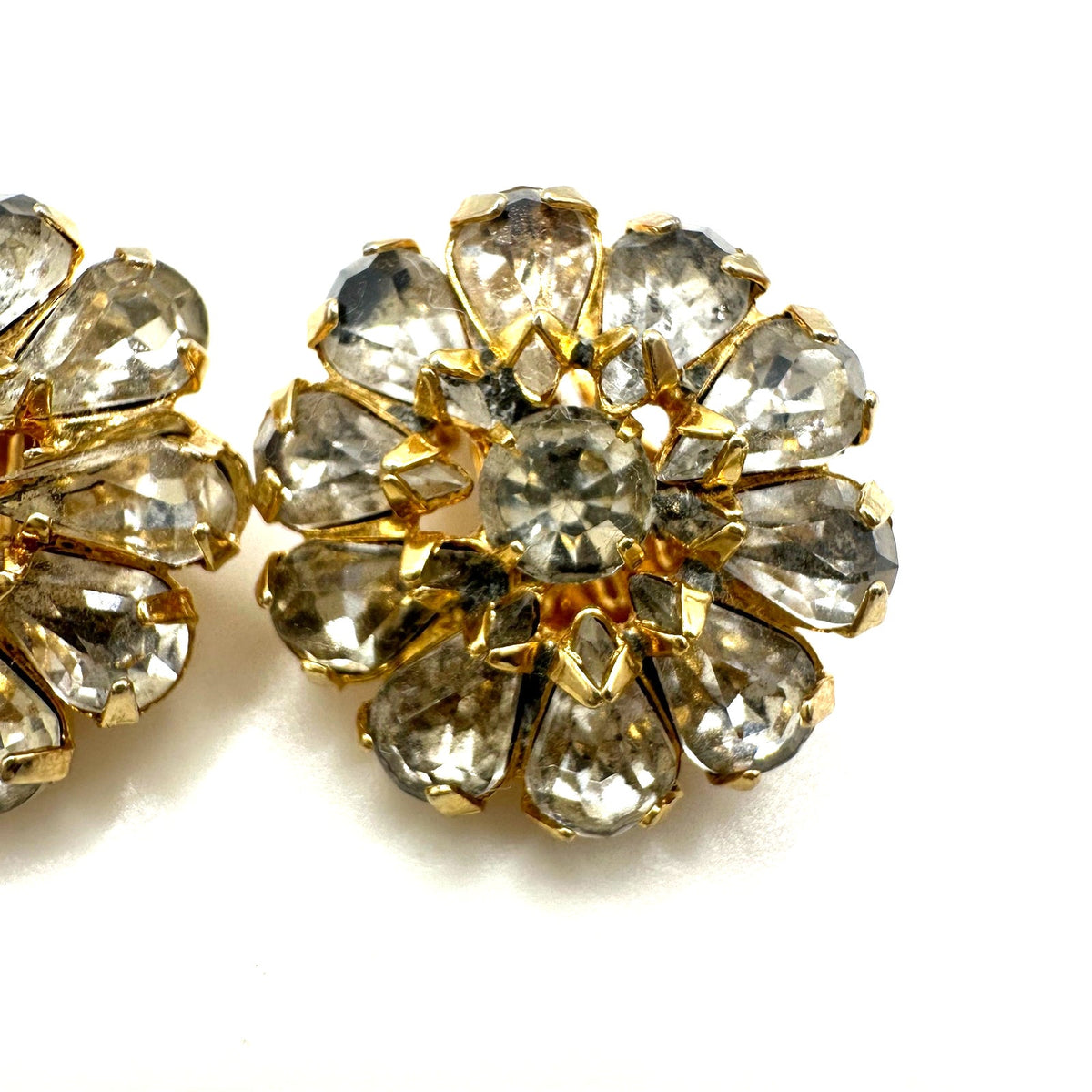 Vintage gold plated clear glass rhinestones round floral clip on earrings