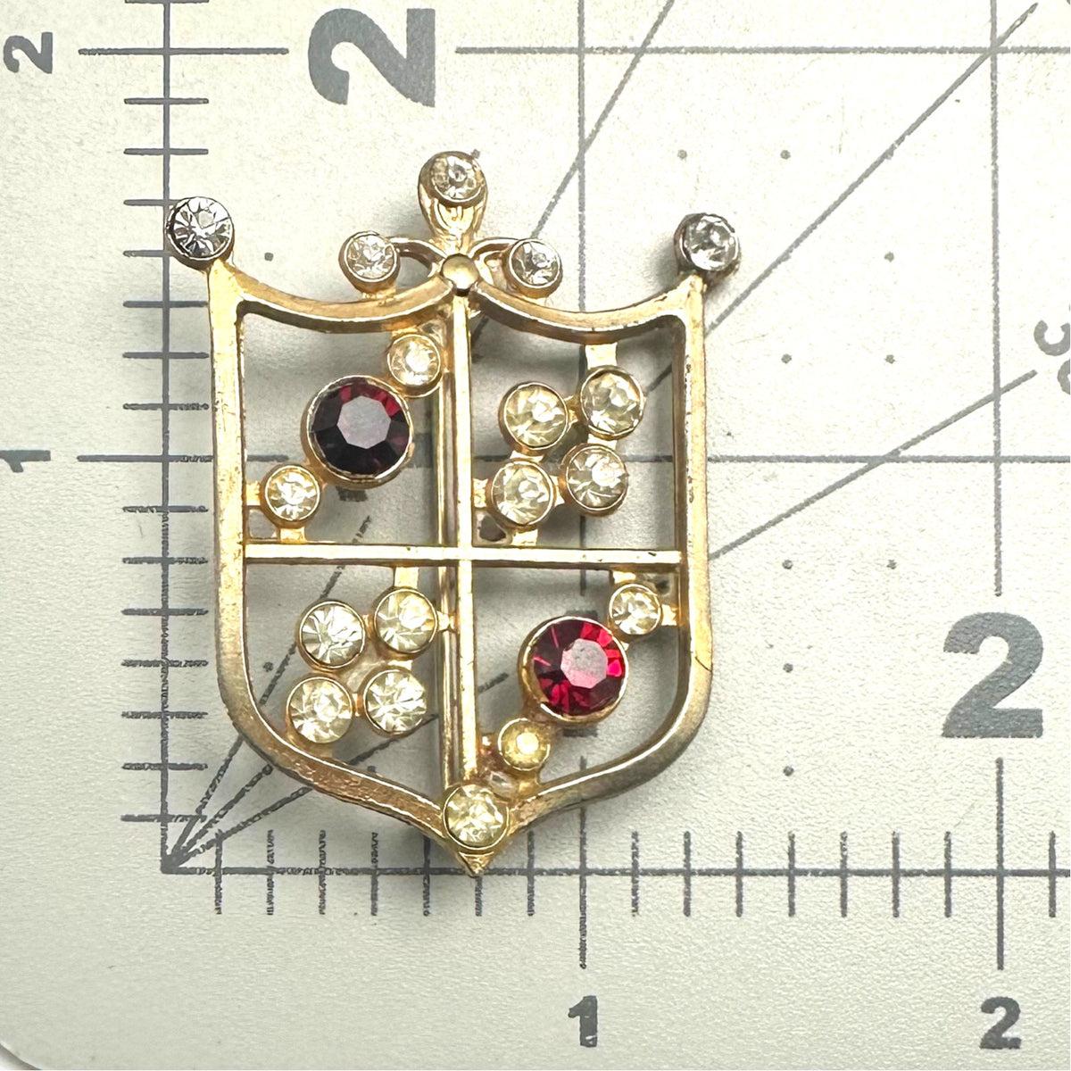 Vintage gold tone red clear rhinestone Heraldic shield crest coat of arms brooch