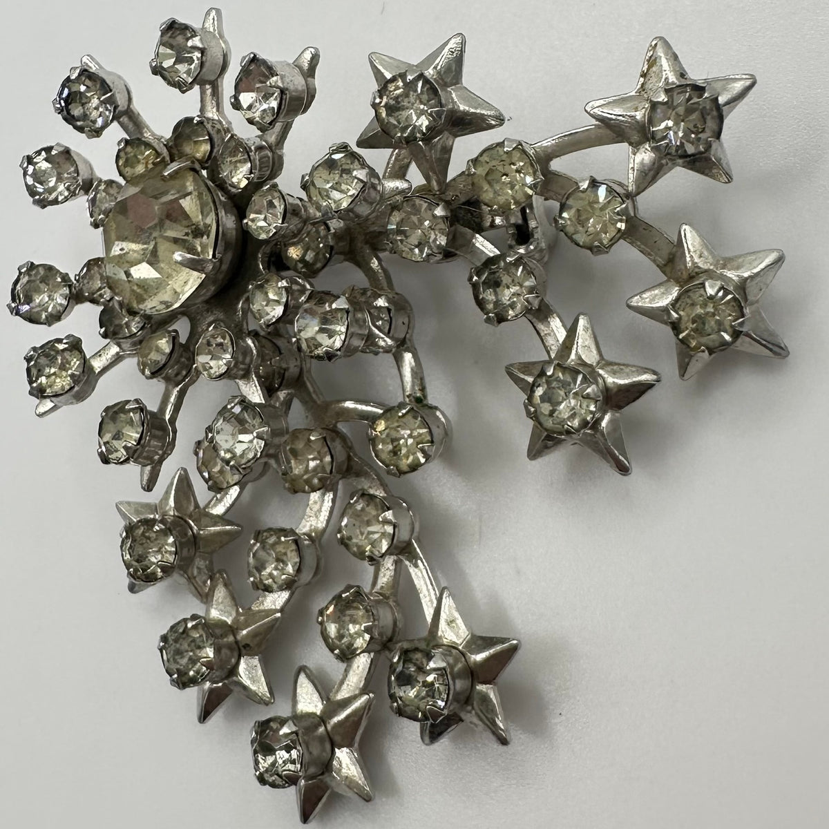 Unsigned Schurin vintage silver tone clear rhinestones stars starburst brooch