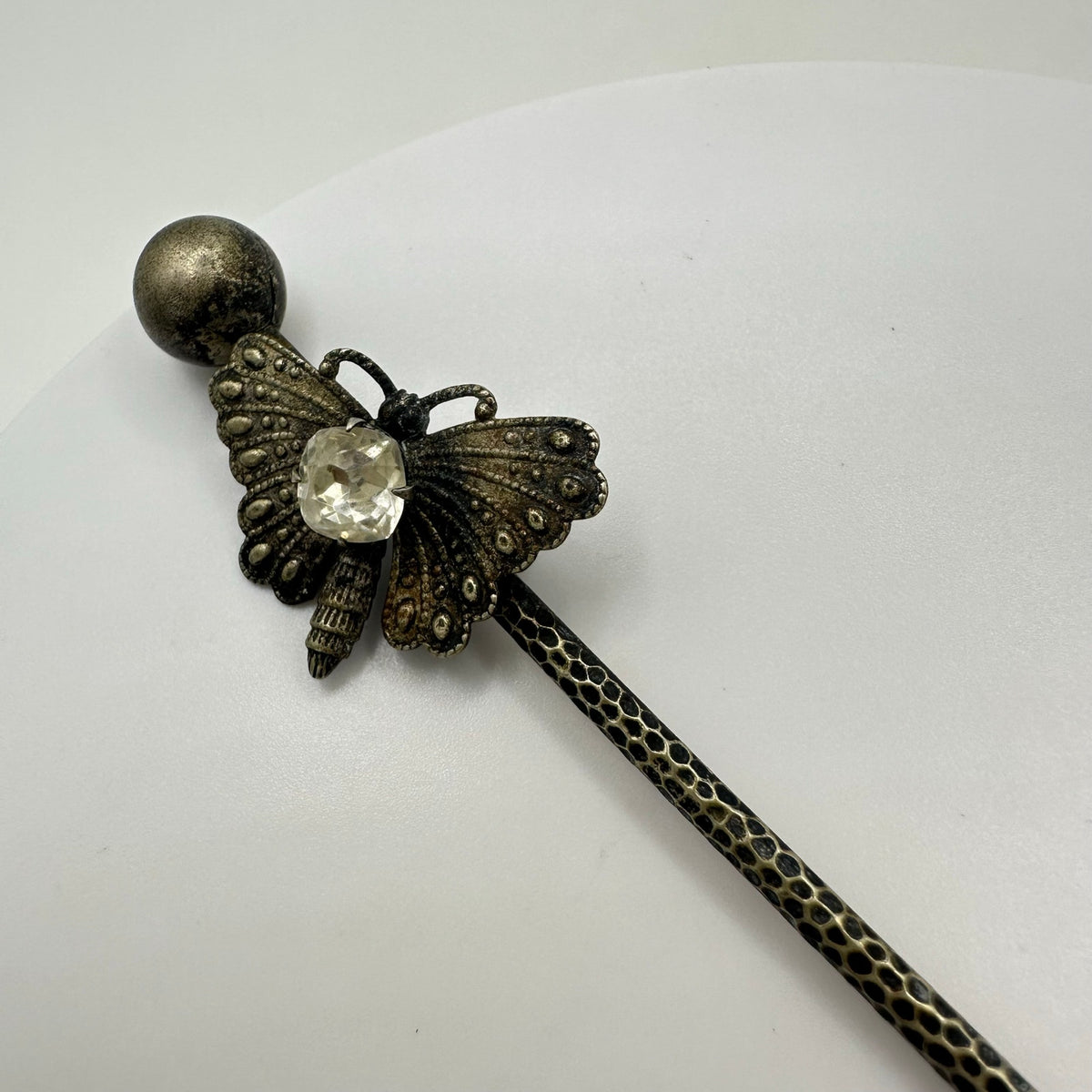 Antique Victorian silver tone textured butterfly clear paste gemstone stick pin