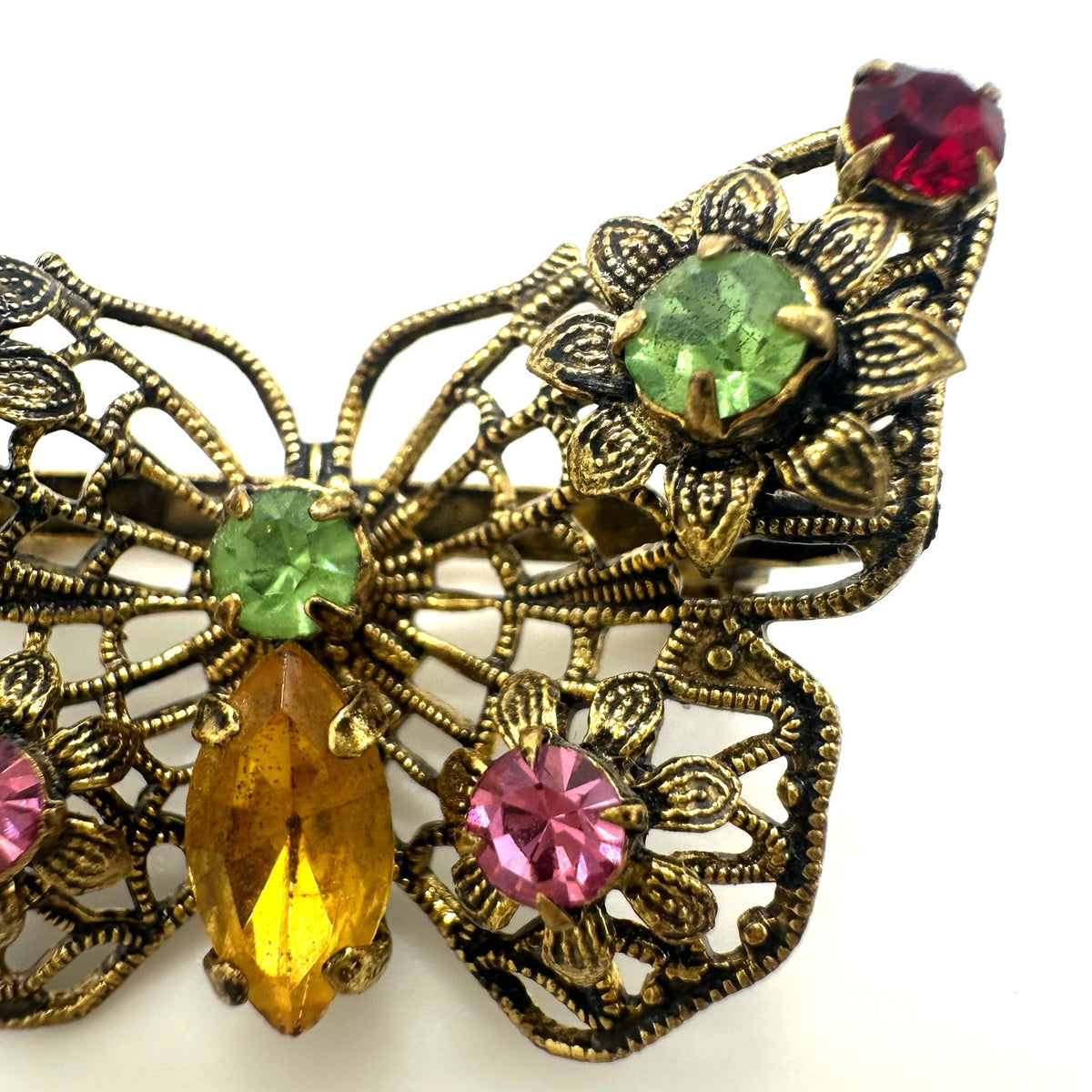 Vintage gold tone filigree multicolor prong set rhinestones butterfly brooch