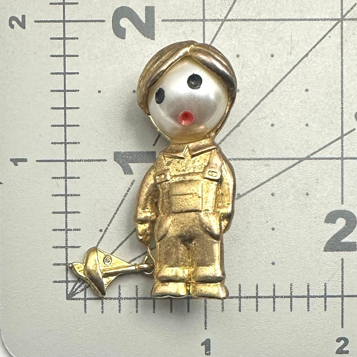 Vintage gold tone boy child with sailboat faux pearl articulated figural brooch