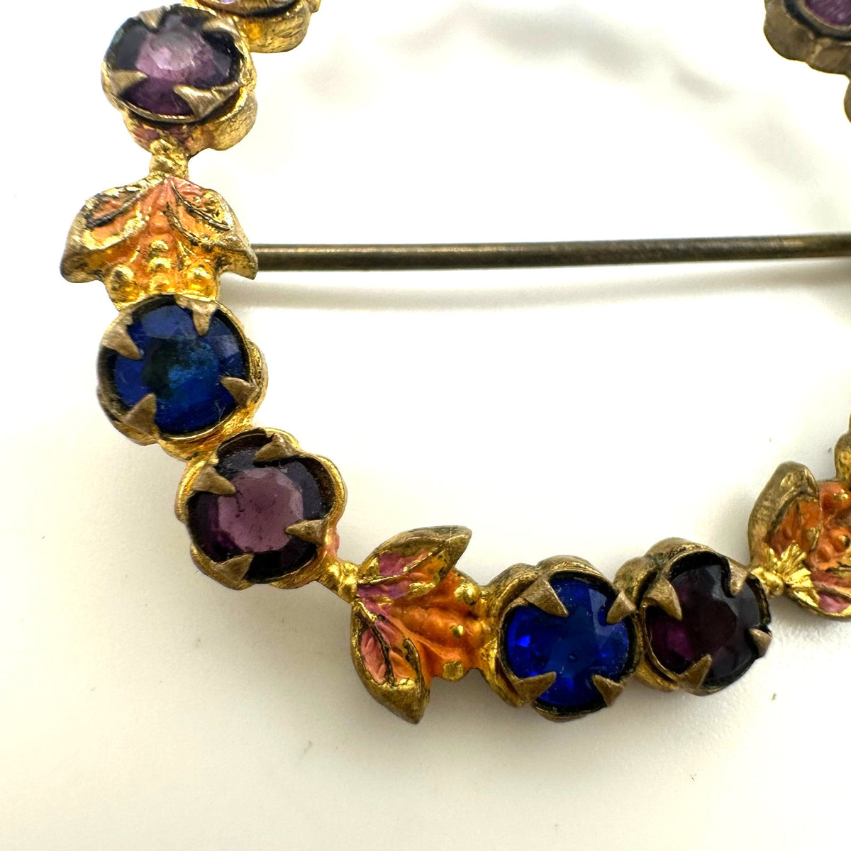 Antique gold tone blue purple Czech glass rhinestones enamel wreath brooch