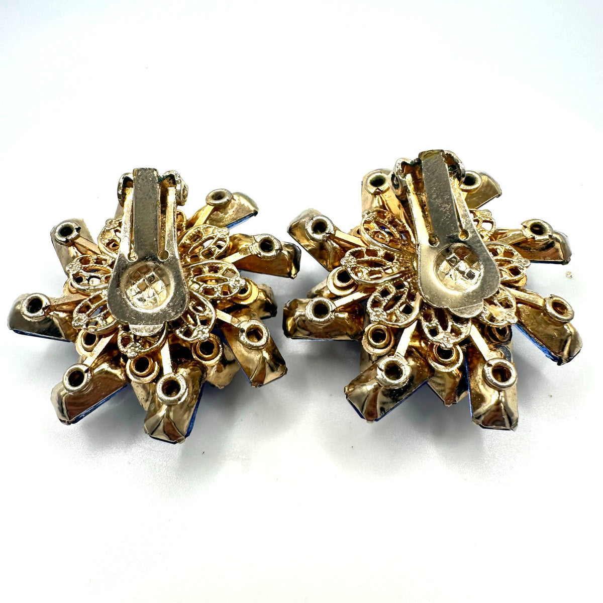Vintage gold tone large royal blue glass rhinestones starburst clip on earrings