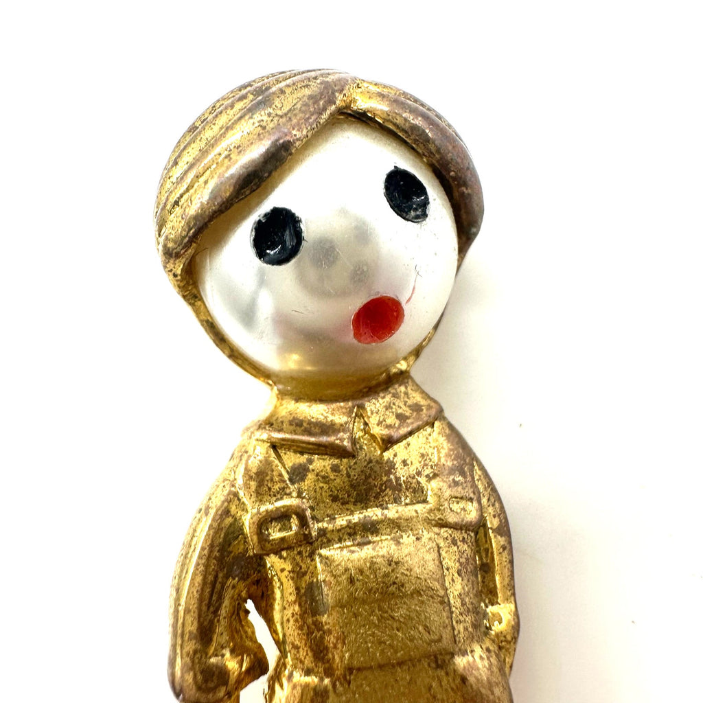 Vintage gold tone boy child with sailboat faux pearl articulated figural brooch