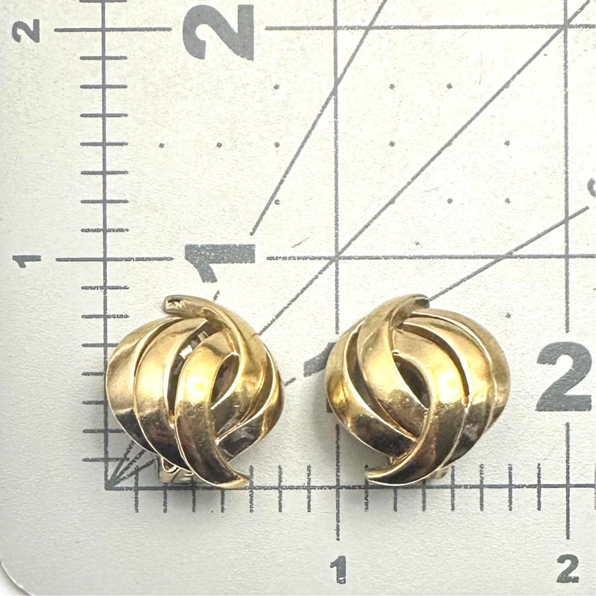 Panetta signed vintage signed gold tone domed abstract leaf clip on earrings