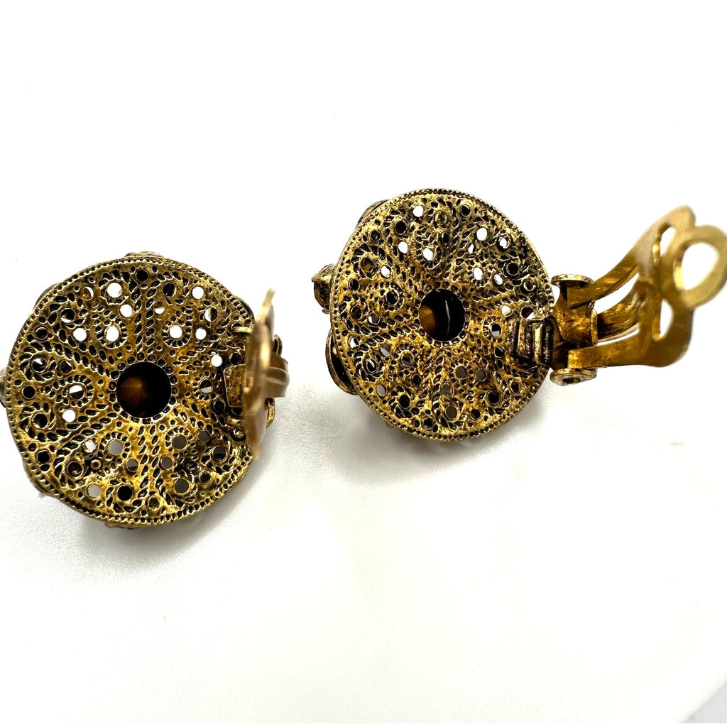 Vintage 1950s gold tone filigree purple glass rhinestones clip on earrings