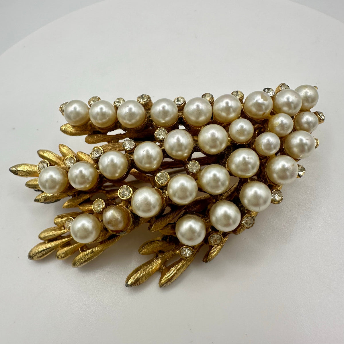 BSK vintage gold tone clear rhinestones faux white pearls beaded leaves brooch