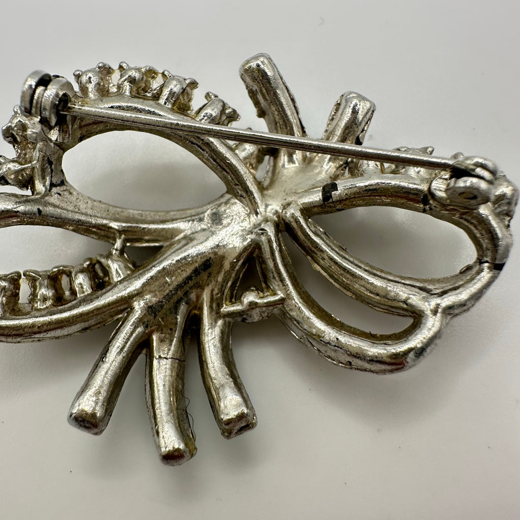 Vintage 1940 silver tone rhodium plated clear blue rhinestones bow brooch