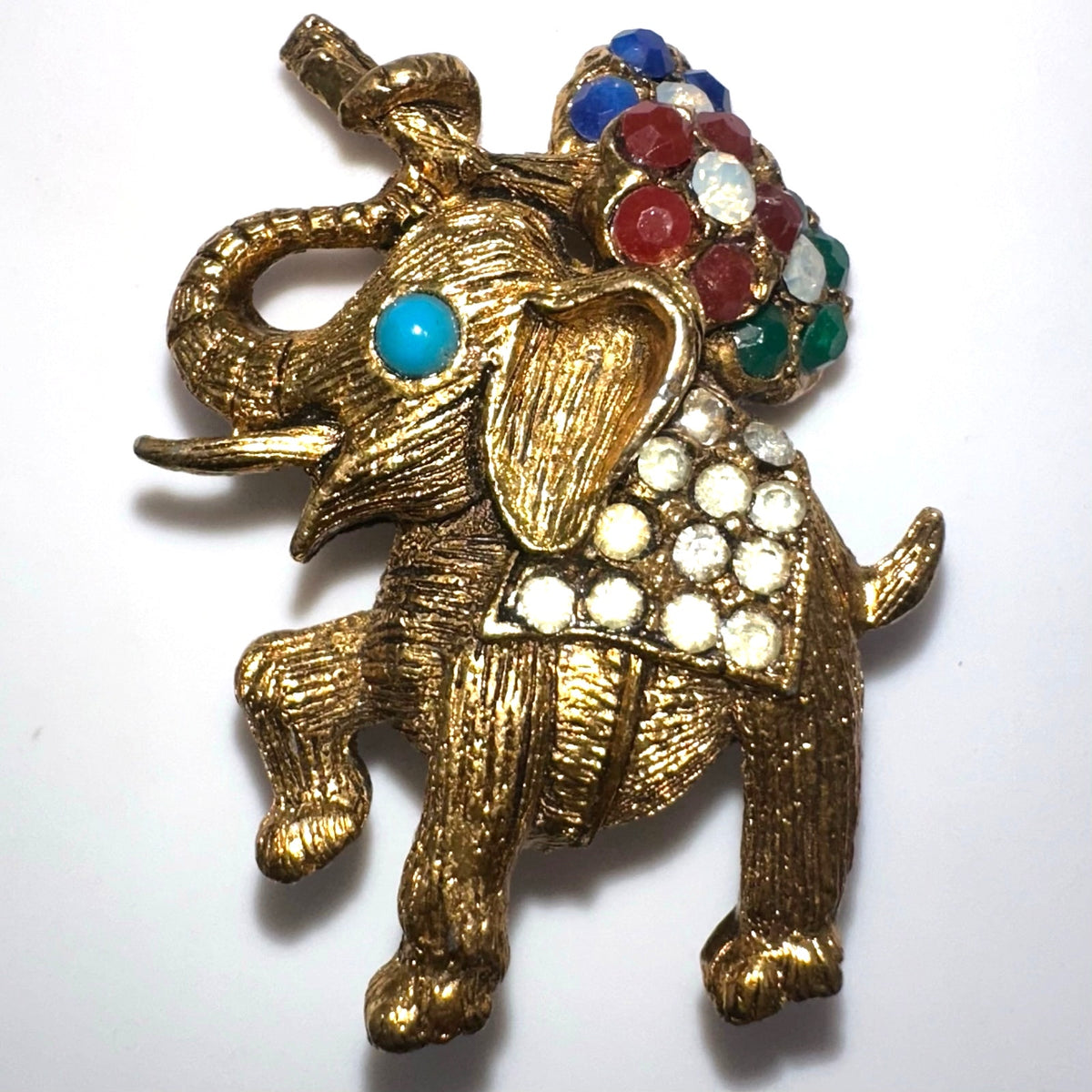 Vintage gold tone multicolor rhinestones elephant flowers figural brooch