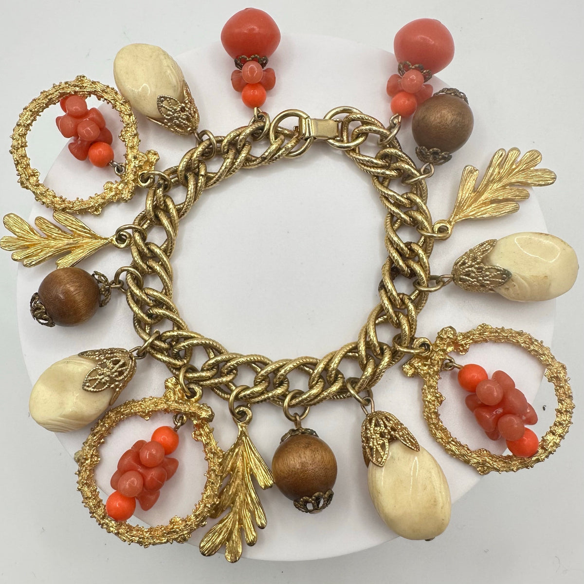 Vintage Victorian Revival gold tone faux coral lucite glass charms bracelet