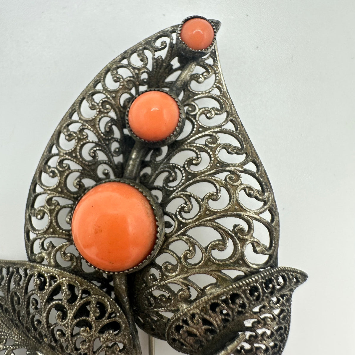 Vintage intricate silver tone filigree leaves orange glass cabochons brooch pin