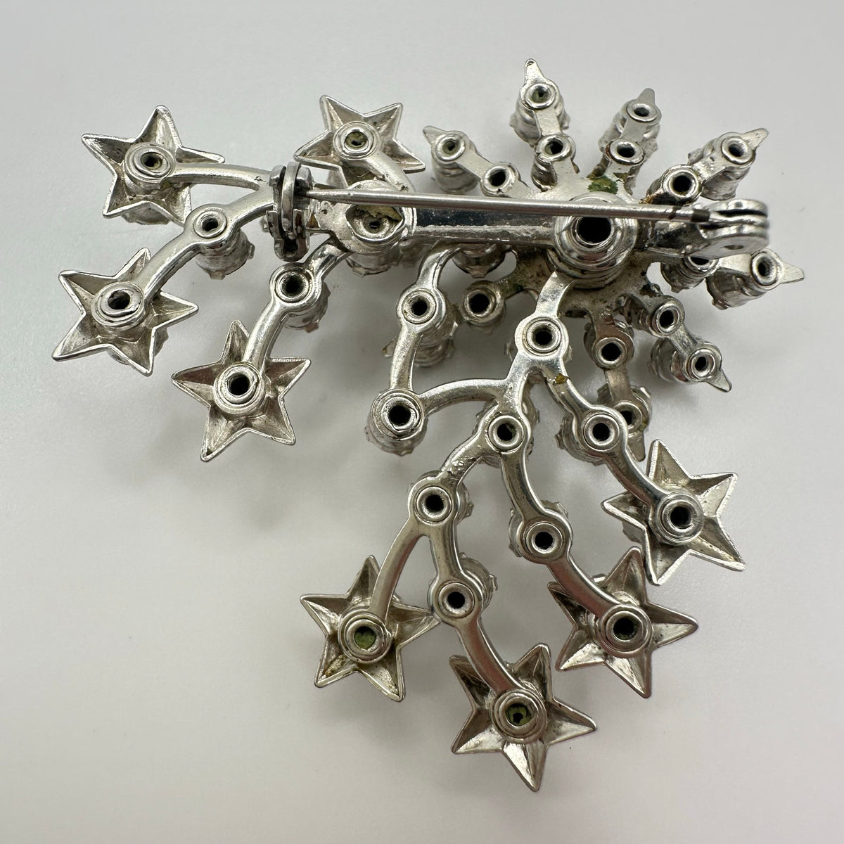 Unsigned Schurin vintage silver tone clear rhinestones stars starburst brooch