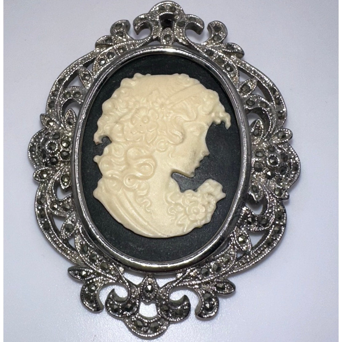 Silver tone rhodium plated genuine marcasite black white cameo brooch pendant