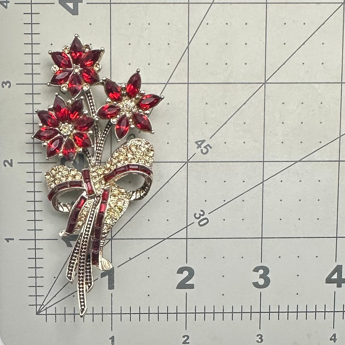 Avon 2013 gold tone red topaz rhinestones poinsettias flowers bouquet brooch