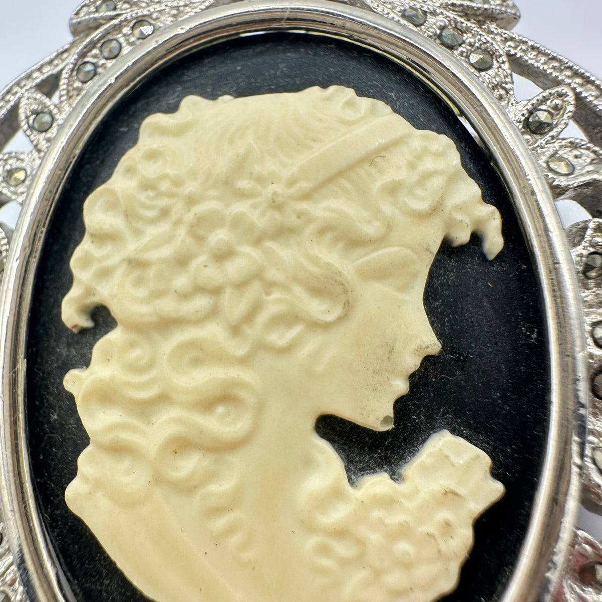 Silver tone rhodium plated genuine marcasite black white cameo brooch pendant