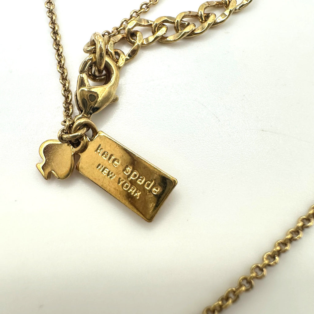 Kate Spade Cause a Stir gold plated opaque orange rhinestone pendant necklace