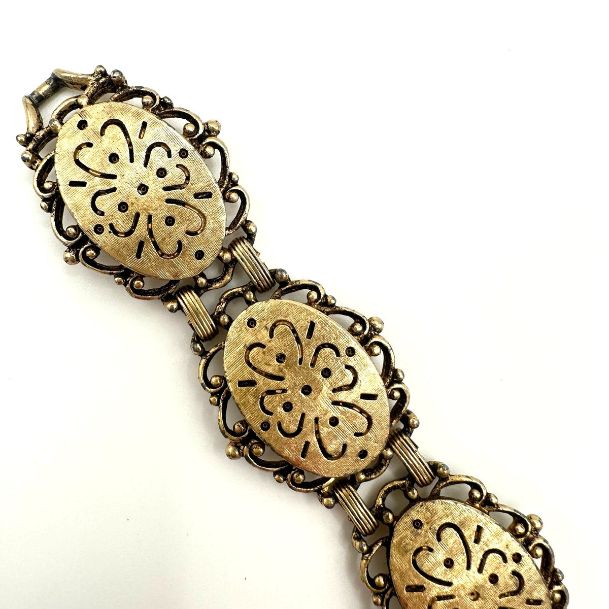 Emmons vintage gold tone dogwood floral textured flex link chain bracelet 7.25"