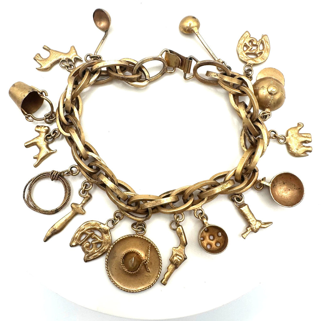 Vintage Made in Mexico midcentury gold tone 16 charms chain bracelet 7.5"