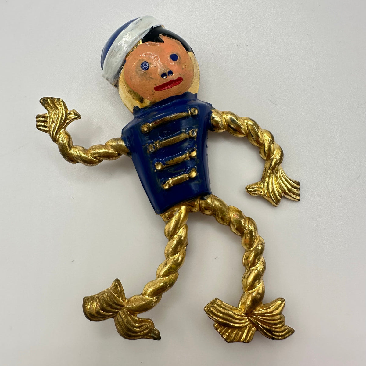 Antique Art Deco 1930s enamel brass boy bellhop Figural rope brooch pin