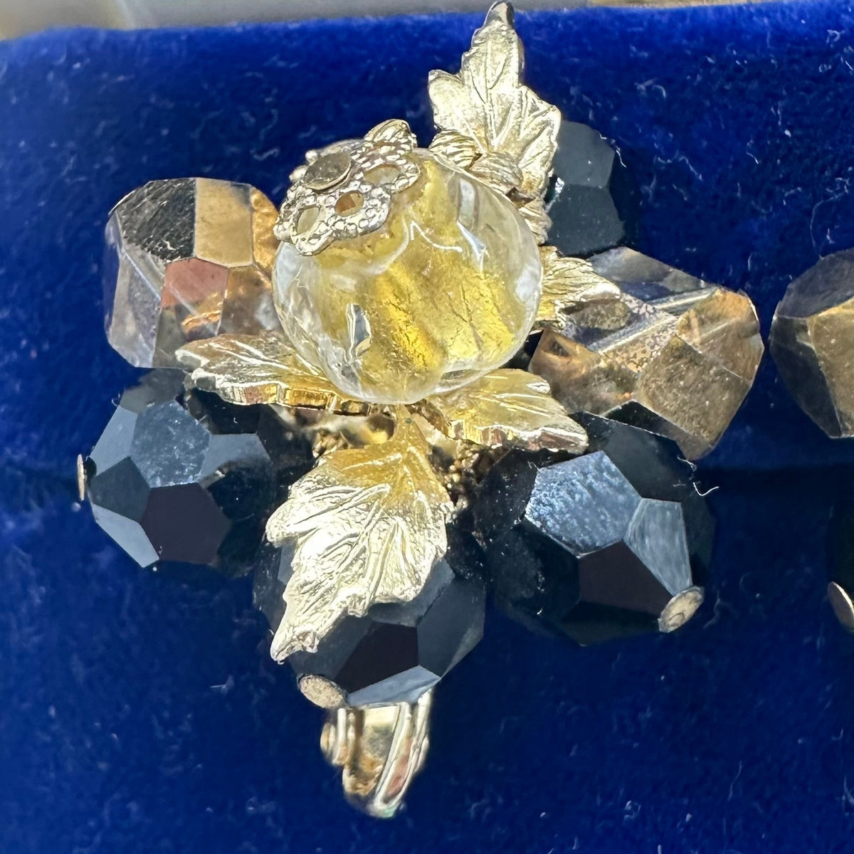 Vendome gold tone leaves black glass beads beaded cluster clip on earrings