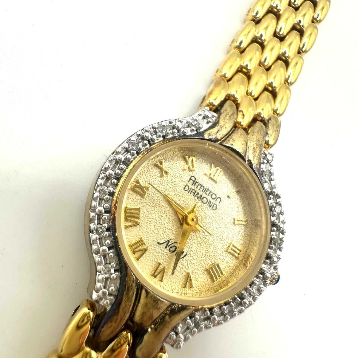 Armitron real diamonds Quartz gold tone round 20.5mm dial stainless steel watch