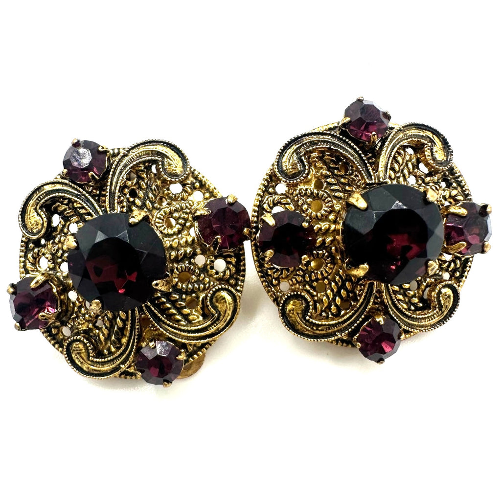 Vintage 1950s gold tone filigree purple glass rhinestones clip on earrings