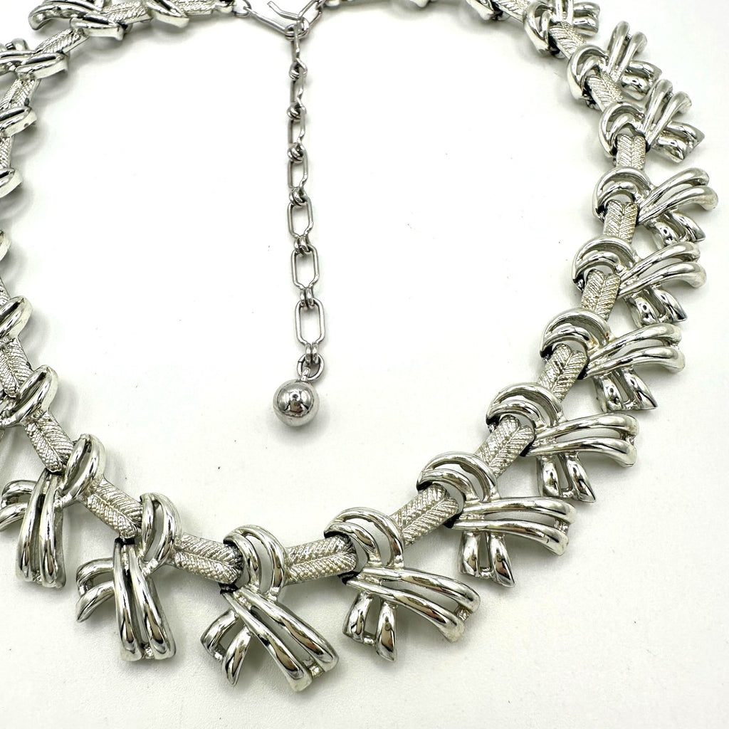 Kramer signed vintage silver tone rhodium plated bows ribbons chain 16” necklace