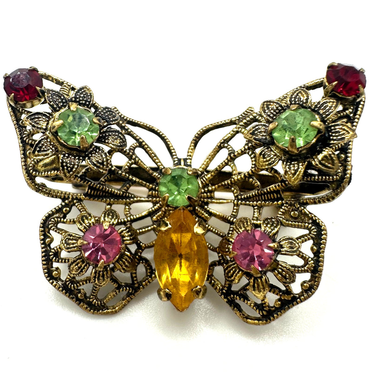 Vintage gold tone filigree multicolor prong set rhinestones butterfly brooch