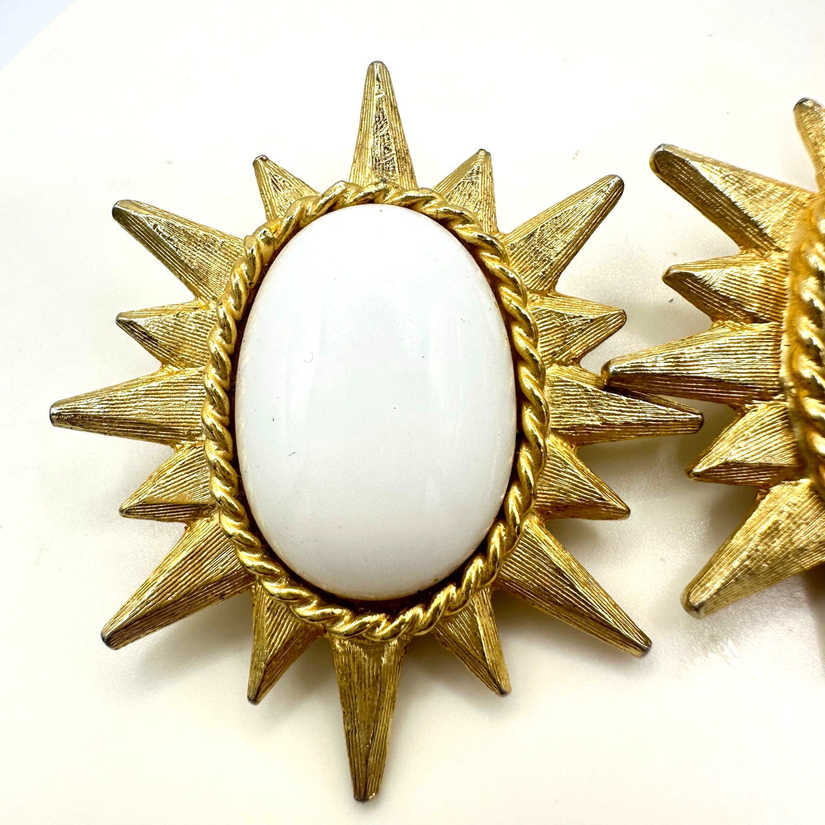 Vintage gold tone large starburst white milk glass cabochons clip on earrings