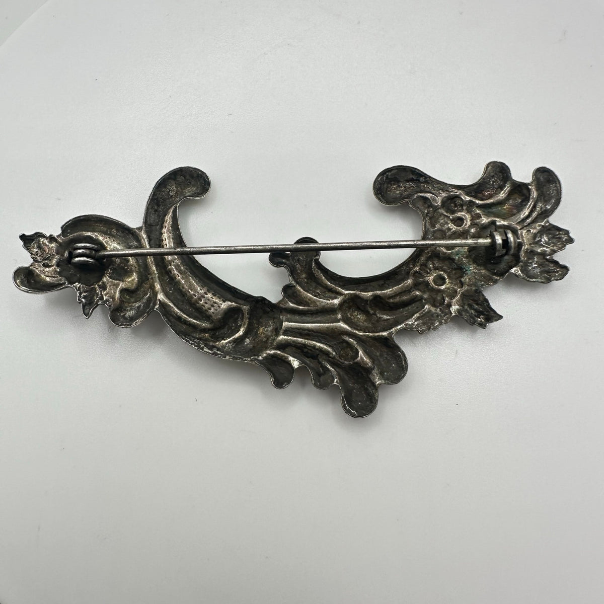 Vintage silver tone Art Nouveau Revival embossed scrollwork floral brooch