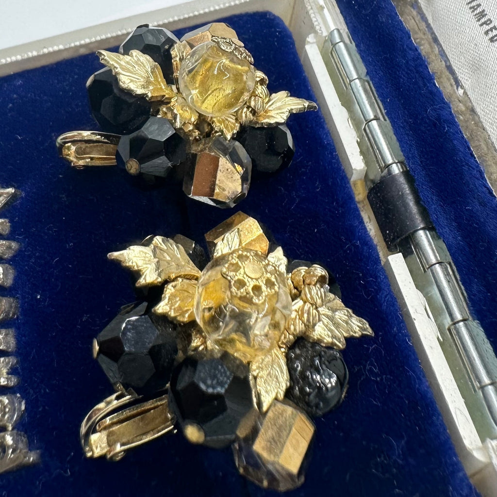 Vendome gold tone leaves black glass beads beaded cluster clip on earrings