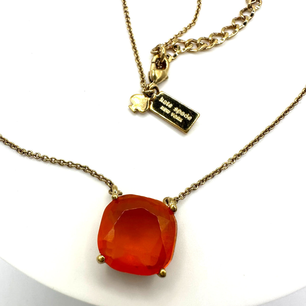 Kate Spade Cause a Stir gold plated opaque orange rhinestone pendant necklace