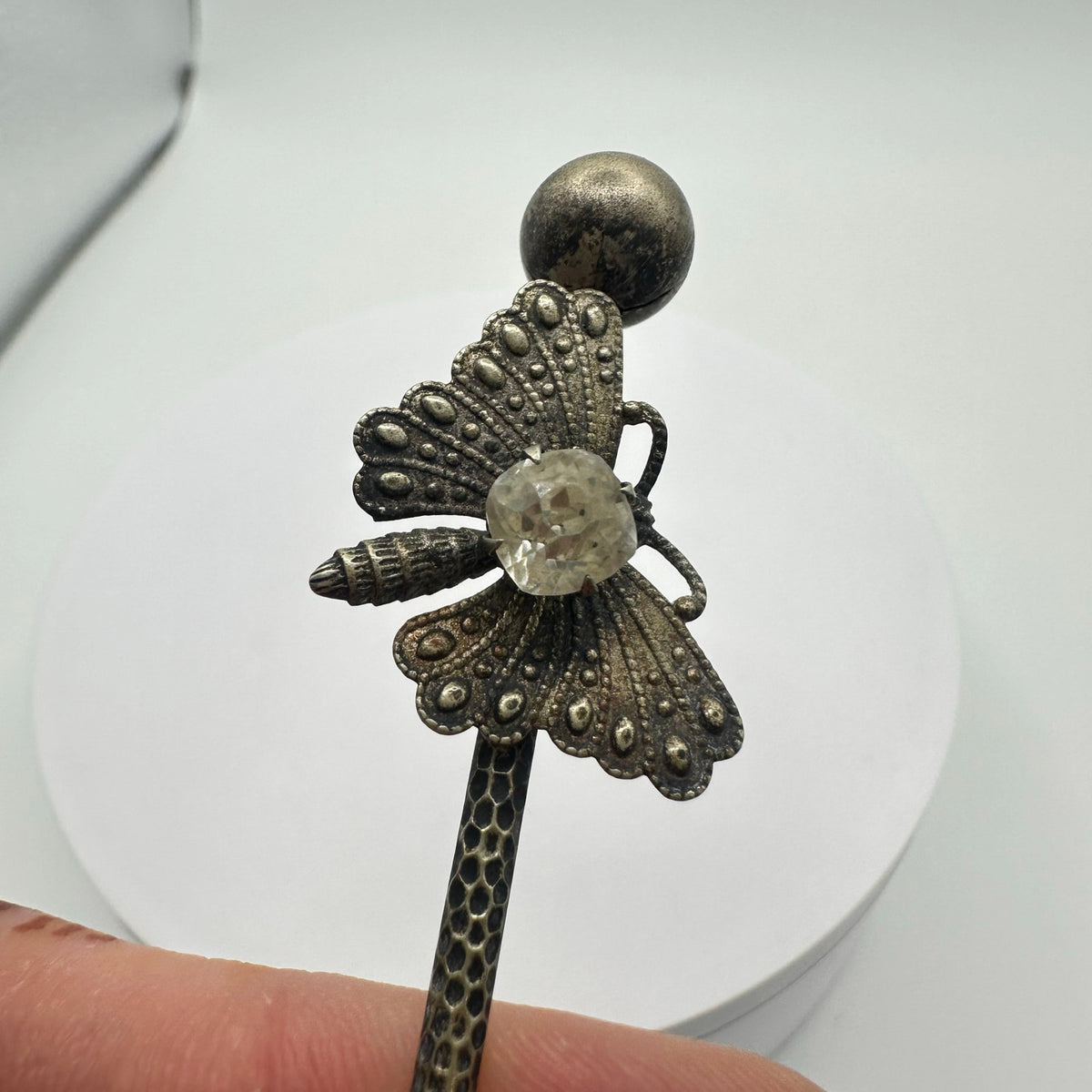 Antique Victorian silver tone textured butterfly clear paste gemstone stick pin