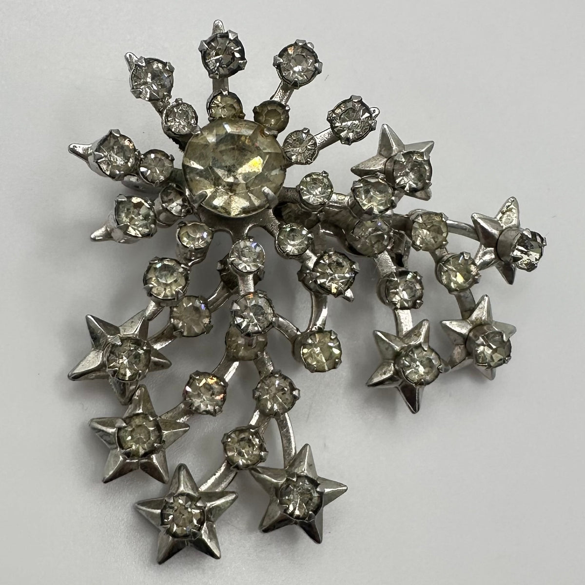 Unsigned Schurin vintage silver tone clear rhinestones stars starburst brooch