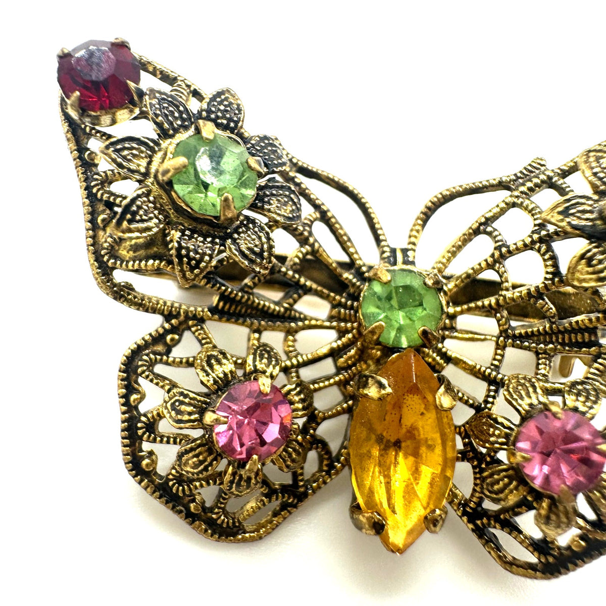 Vintage gold tone filigree multicolor prong set rhinestones butterfly brooch