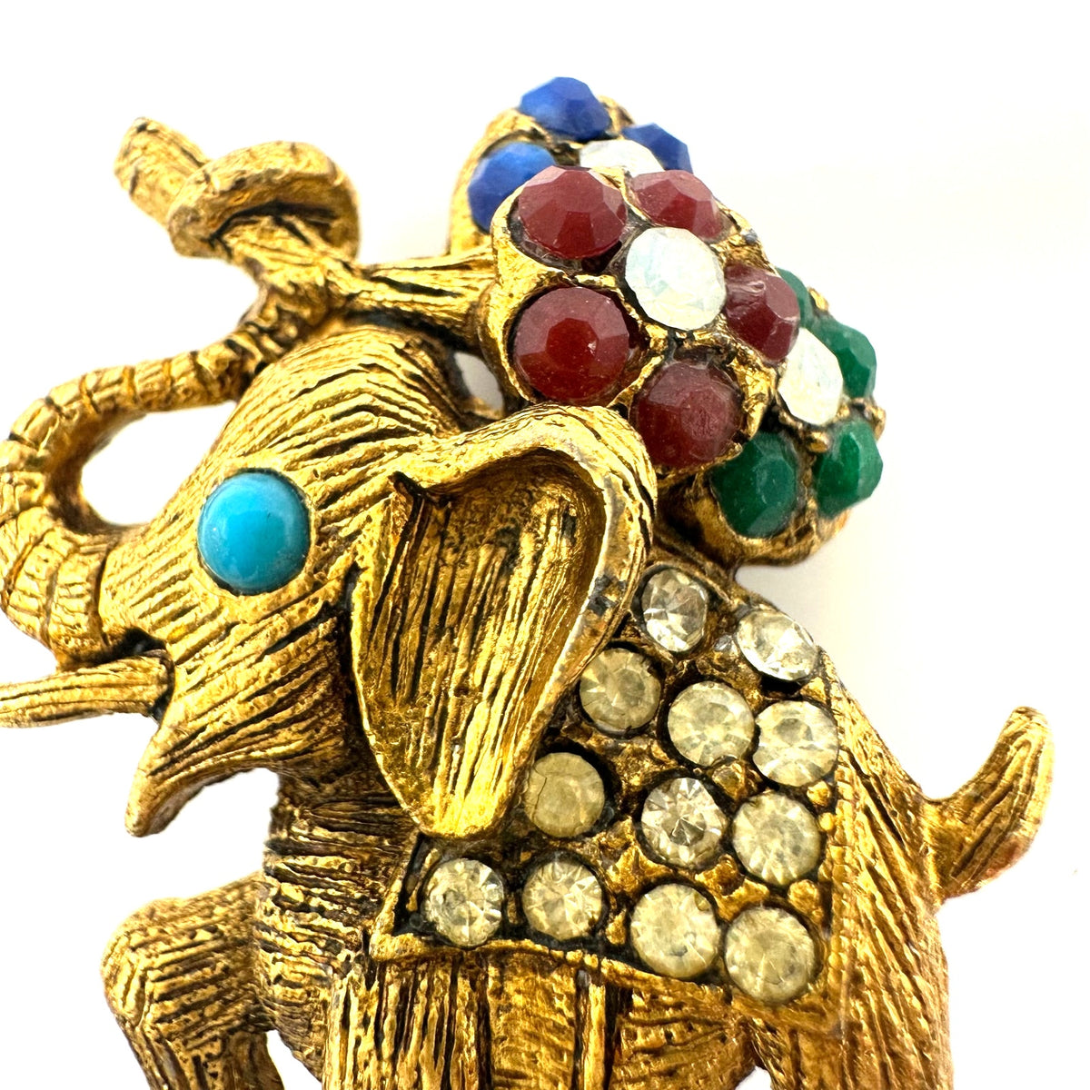 Vintage gold tone multicolor rhinestones elephant flowers figural brooch