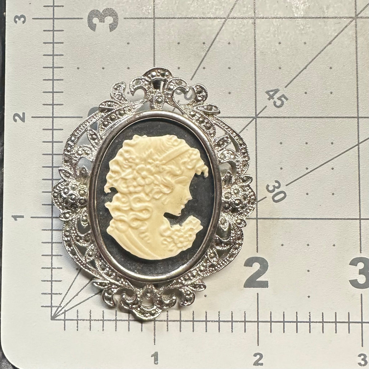 Silver tone rhodium plated genuine marcasite black white cameo brooch pendant