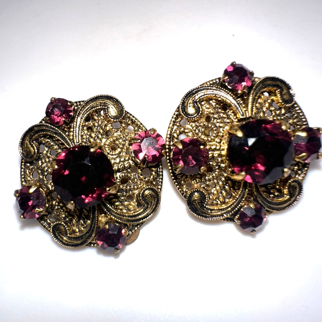 Vintage 1950s gold tone filigree purple glass rhinestones clip on earrings
