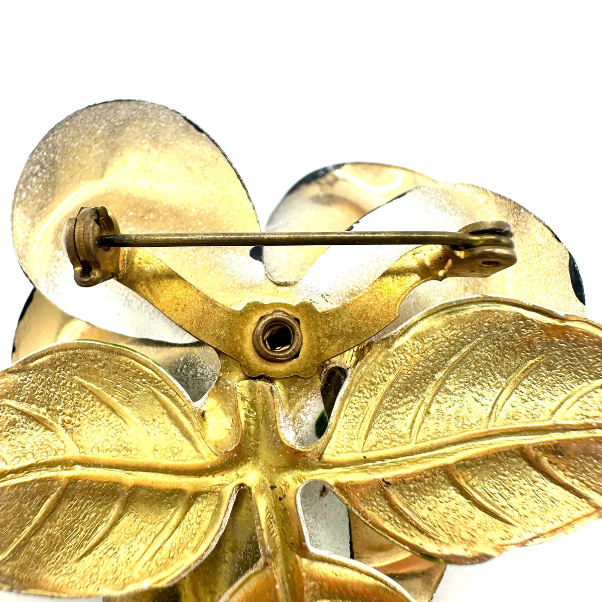 Vintage 1960s black white green enamel gold tone metal flower flower brooch