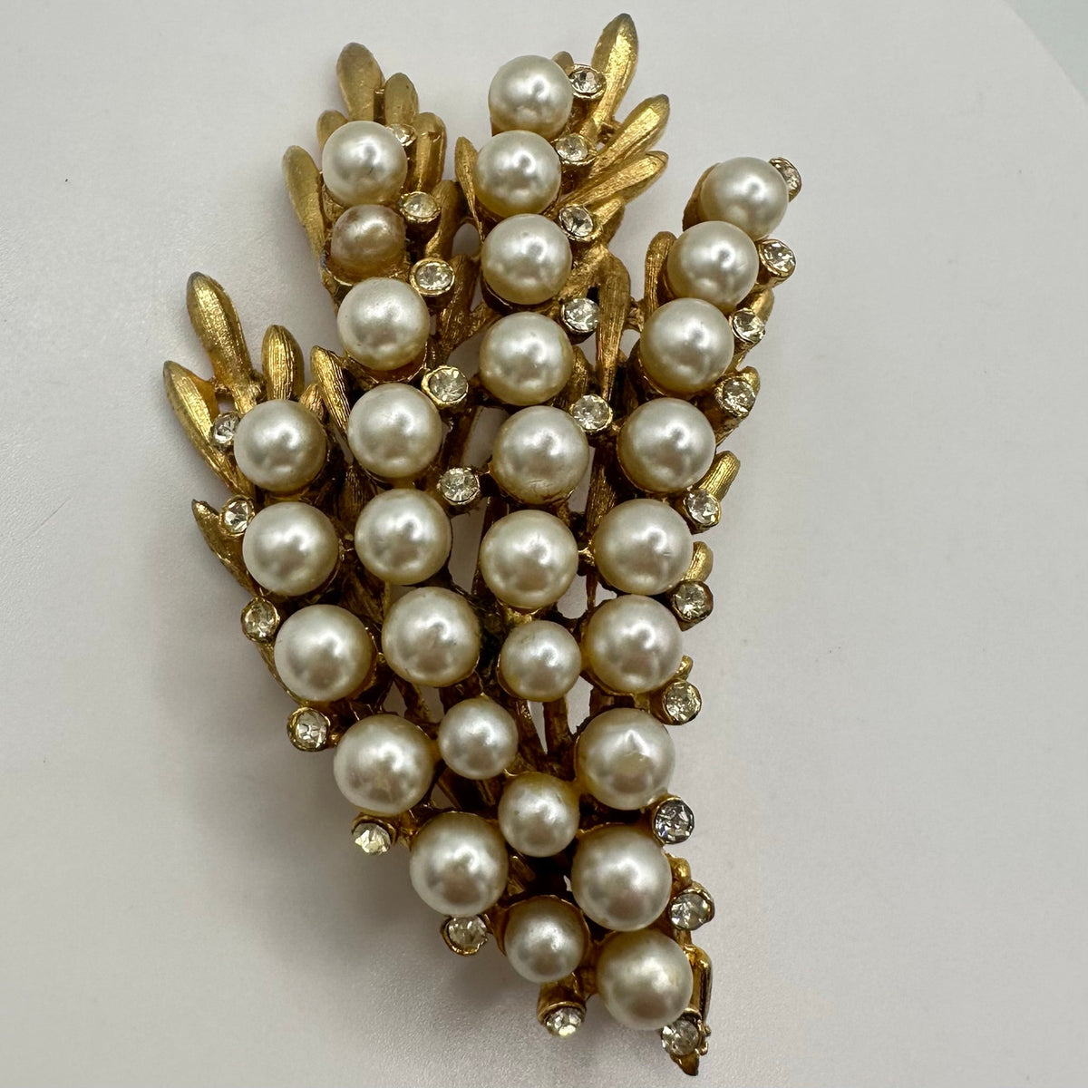 BSK vintage gold tone clear rhinestones faux white pearls beaded leaves brooch